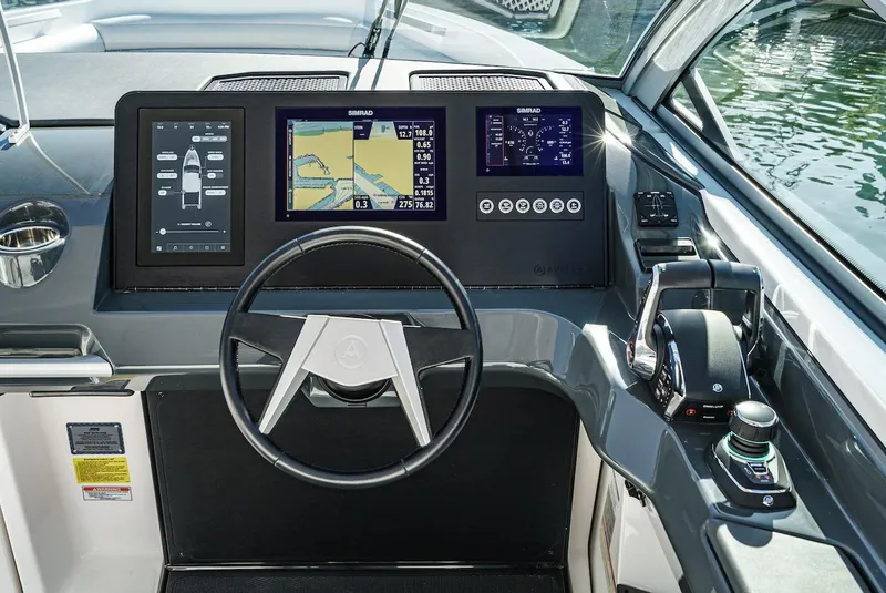 Slide: The Image of 2024 Aviara AV 32 boat dashboard with advanced navigation and control systems. - 35