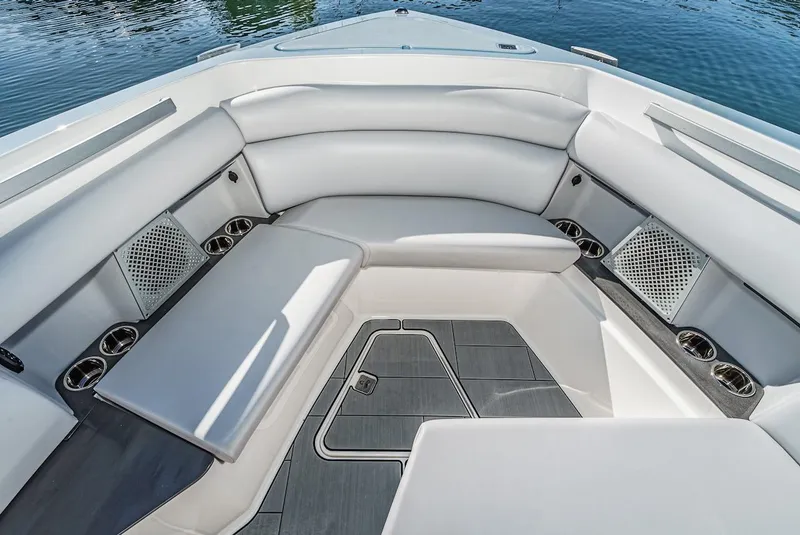 Slide: The Image of 2024 Aviara AV 32 boat interior with luxurious seating and cup holders. - 40