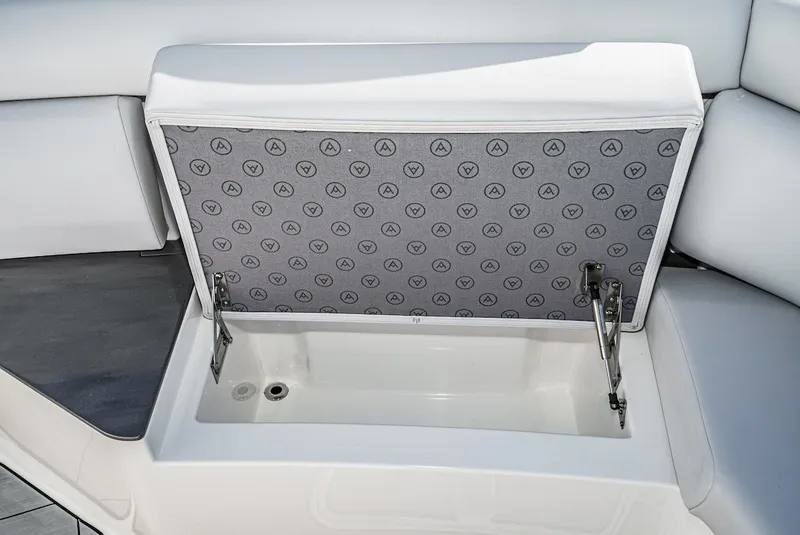 Slide: The Image of 2024 Aviara AV 32 boat storage compartment with cushioned lid open. - 42