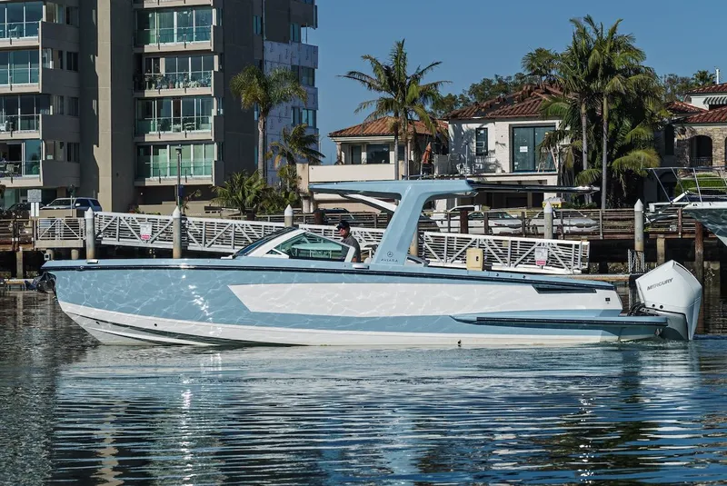 Slide: The Image of 2024 Aviara AV 32 boat docked near waterfront homes. - 7