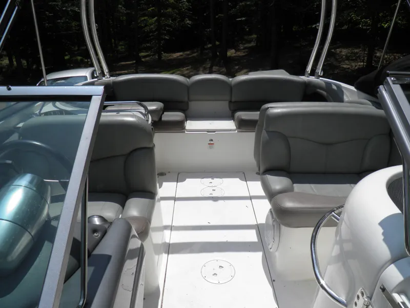 Slide: The Image of 2006 MasterCraft 280 SST boat interior with gray seating and open deck. - 12
