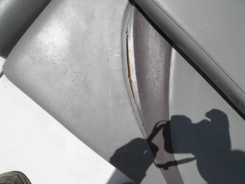 Slide: The Image of Torn upholstery on a 2006 MasterCraft 280 SST boat seat. - 13