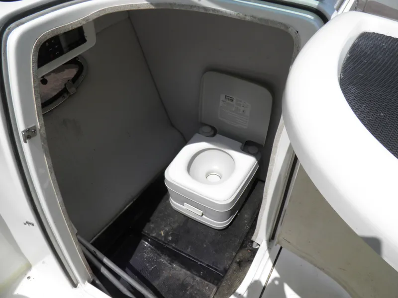 Slide: The Image of 2006 MasterCraft 280 SST boat interior with portable toilet. - 14