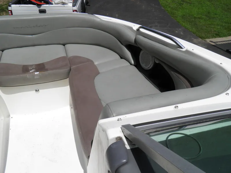 Slide: The Image of 2006 MasterCraft 280 SST boat interior seating area with gray and beige upholstery. - 18