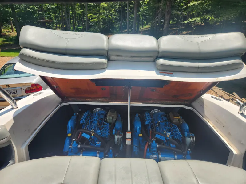 Slide: The Image of 2006 MasterCraft 280 SST boat with open engine compartment showing twin engines. - 22