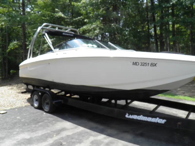 Slide: The Image of 2006 MasterCraft 280 SST boat on a trailer in a wooded area. - 4