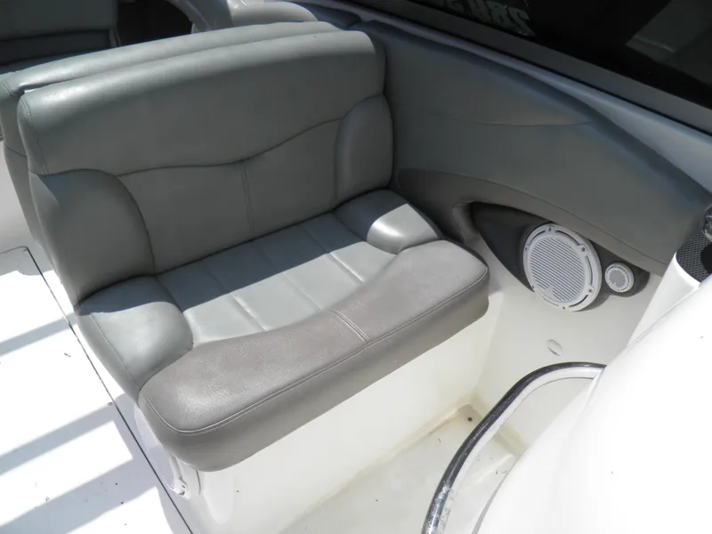 Slide: The Image of 2006 MasterCraft 280 SST boat interior with gray leather seating and speaker. - 9