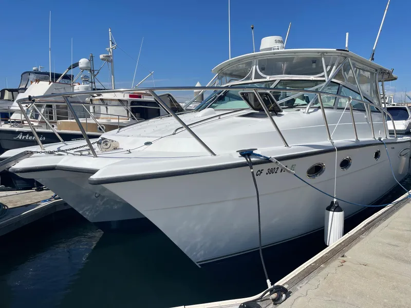 The Image of 2004 Glacier Bay Ocean Runner 3470 docked at marina under clear blue sky. - 0