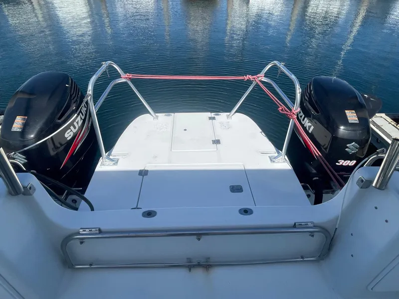 Slide: The Image of 2004 Glacier Bay Ocean Runner 3470 with dual Suzuki 300 engines at dock. - 13