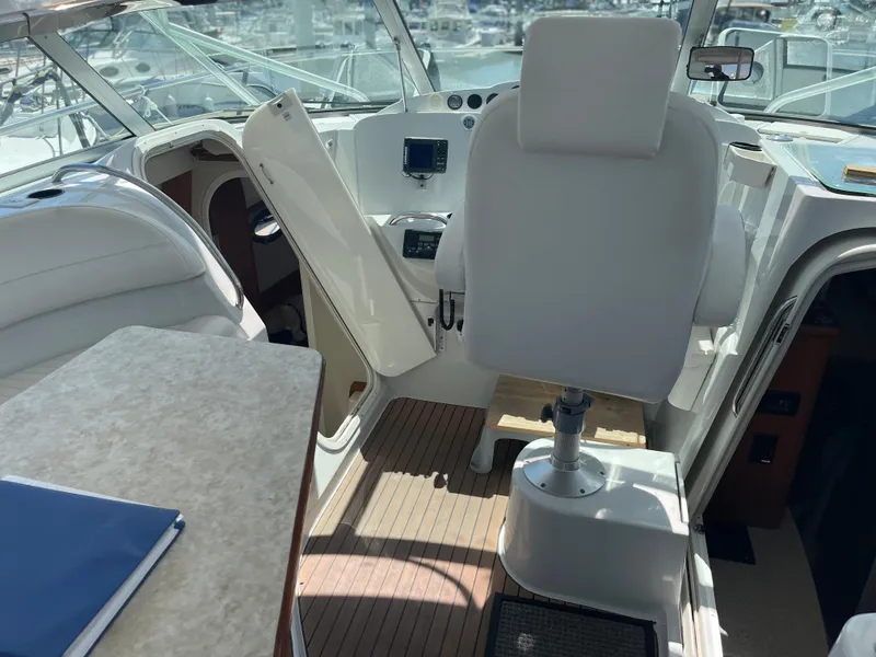 Slide: The Image of Interior of 2004 Glacier Bay Ocean Runner 3470 boat, featuring helm and seating area. - 14