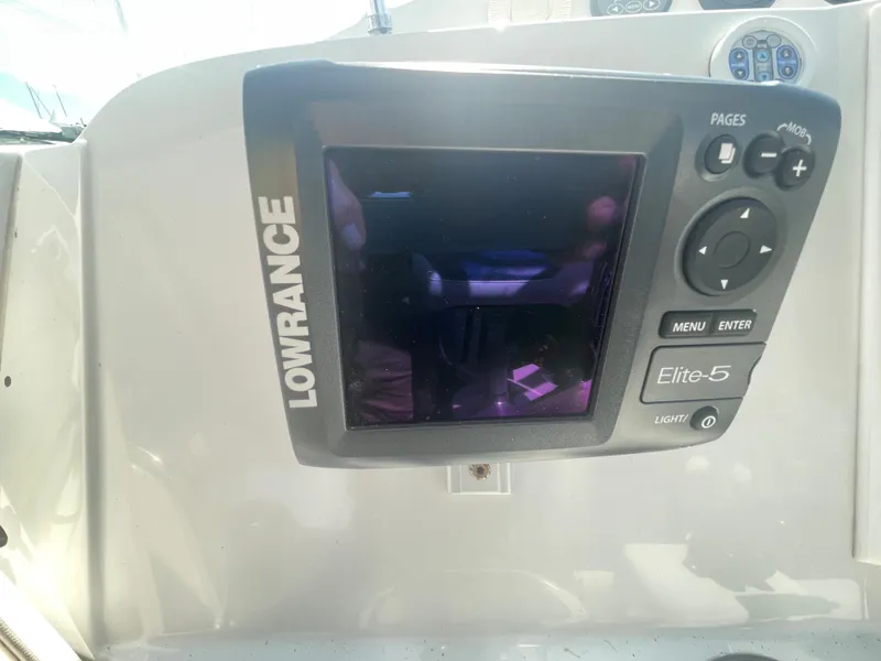 Slide: The Image of Lowrance Elite-5 fishfinder on 2004 Glacier Bay Ocean Runner 3470 boat dashboard. - 17
