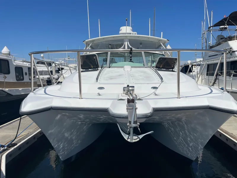 Slide: The Image of 2004 Glacier Bay Ocean Runner 3470 catamaran docked at marina, front view. - 2