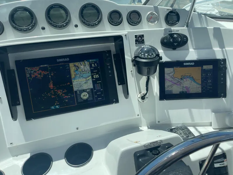 Slide: The Image of Control panel of 2004 Glacier Bay Ocean Runner 3470 with navigation screens and compass. - 25