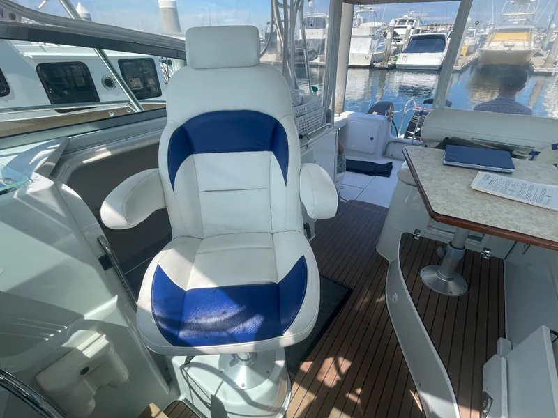 Slide: The Image of Captain's chair on 2004 Glacier Bay Ocean Runner 3470, docked at marina. - 28
