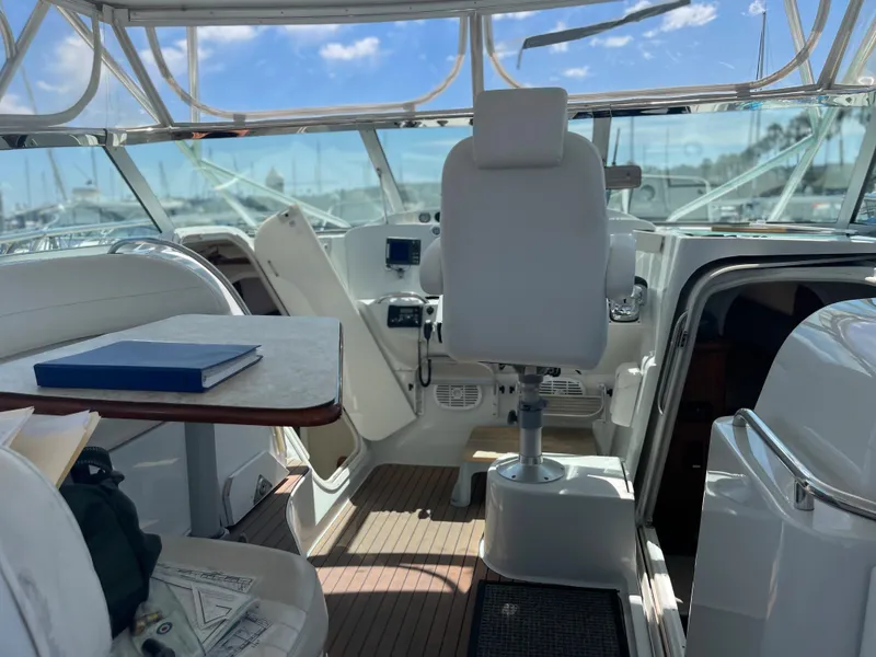 Slide: The Image of Interior of 2004 Glacier Bay Ocean Runner 3470 boat with helm and seating area. - 29