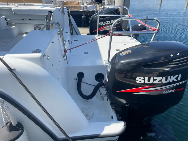 Slide: The Image of 2004 Glacier Bay Ocean Runner 3470 with Suzuki outboard engines at dock. - 3