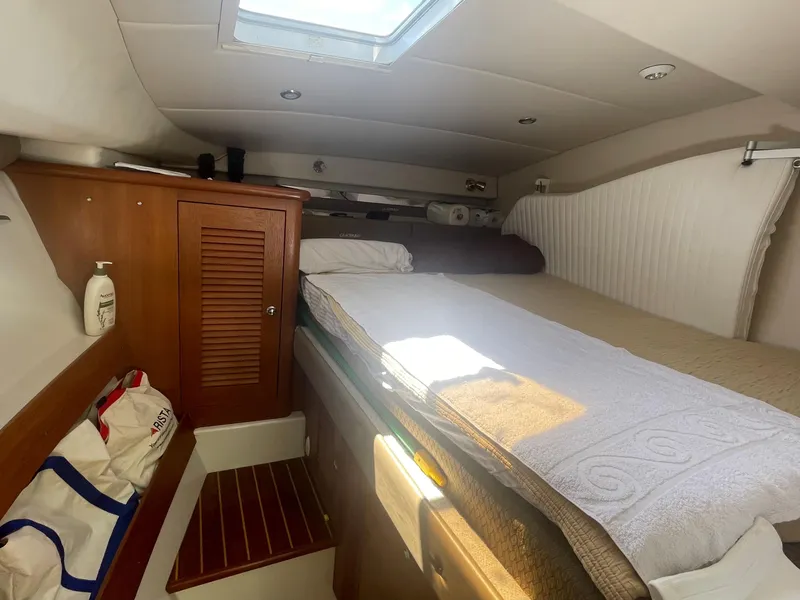 Slide: The Image of Cozy cabin interior of 2004 Glacier Bay Ocean Runner 3470 with bed and storage. - 33