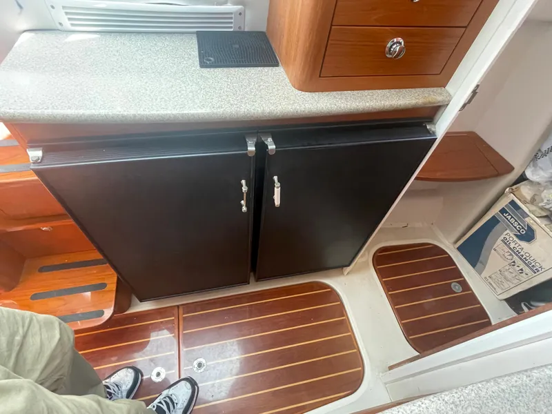 Slide: The Image of Interior of 2004 Glacier Bay Ocean Runner 3470, featuring cabinetry and wood flooring. - 35