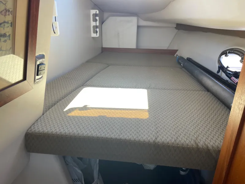 Slide: The Image of Interior cabin of 2004 Glacier Bay Ocean Runner 3470 with cushioned sleeping area. - 37