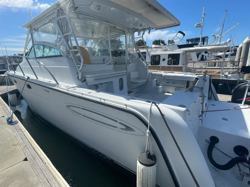 Slide: The Image of 2004 Glacier Bay Ocean Runner 3470 docked at marina under clear blue sky. - 4