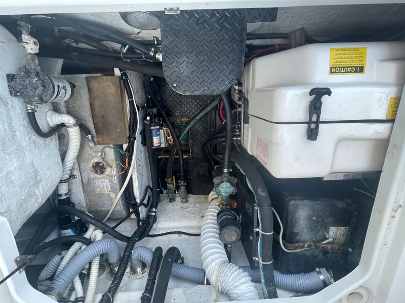 Slide: The Image of Engine compartment of a 2004 Glacier Bay Ocean Runner 3470, showcasing various mechanical components. - 40