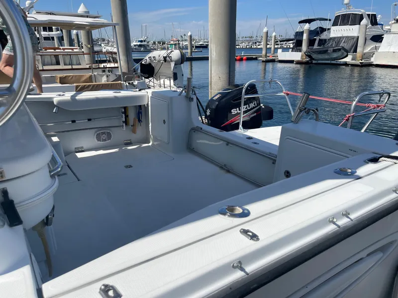 Slide: The Image of 2004 Glacier Bay Ocean Runner 3470 boat docked at marina with Suzuki outboard motor. - 5