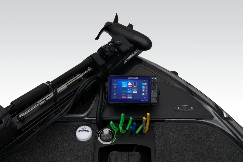 Slide: The Image of 2024 Nitro Z20 Pro boat dashboard with Lowrance electronics and fishing rod holders. - 16