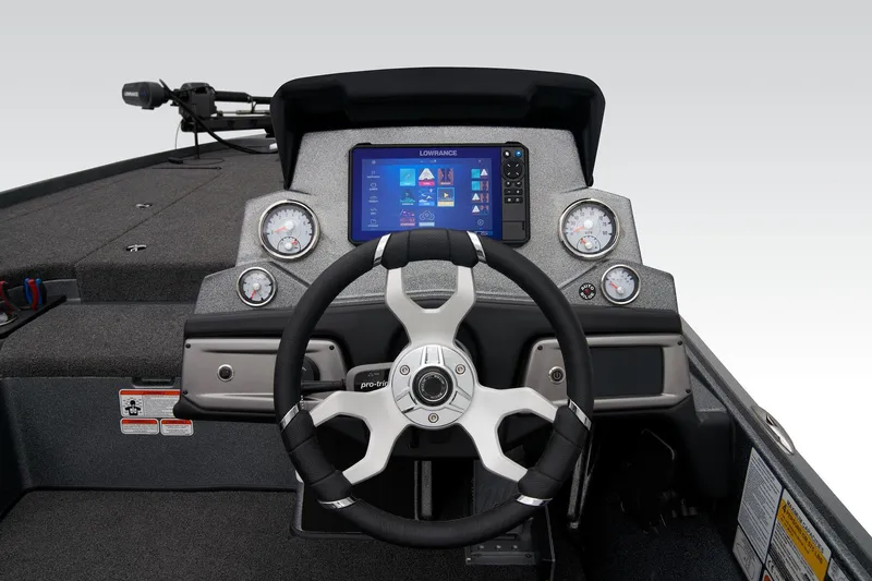 Slide: The Image of 2024 Nitro Z20 Pro boat dashboard with steering wheel and digital display. - 34