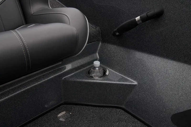 Slide: The Image of Interior of 2024 Nitro Z20 Pro boat with cup holder and grey seating. - 47