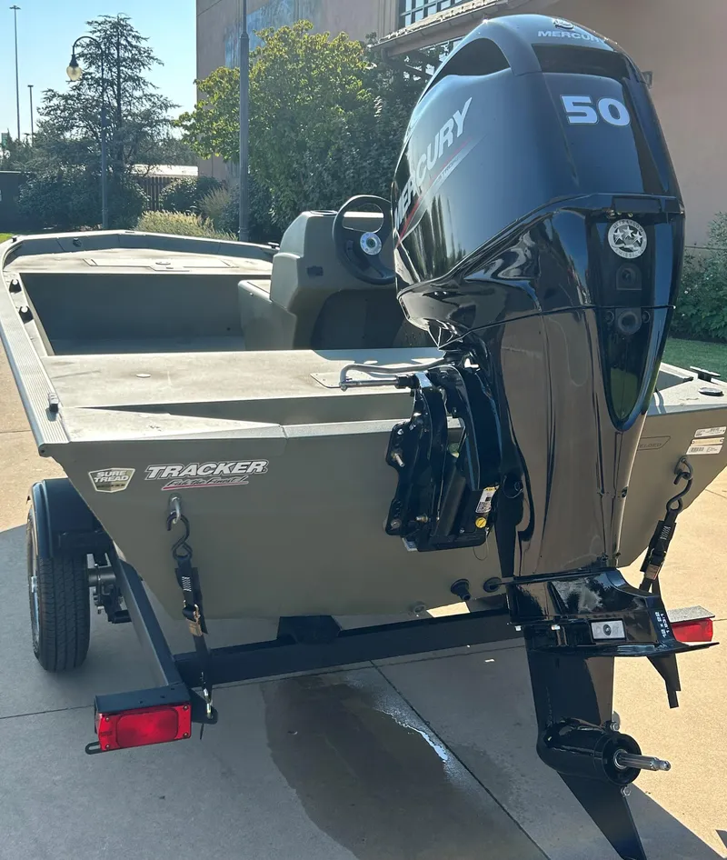 Slide: The Image of 2024 Tracker Grizzly 1648 SC boat with Mercury 50 outboard motor. - 2