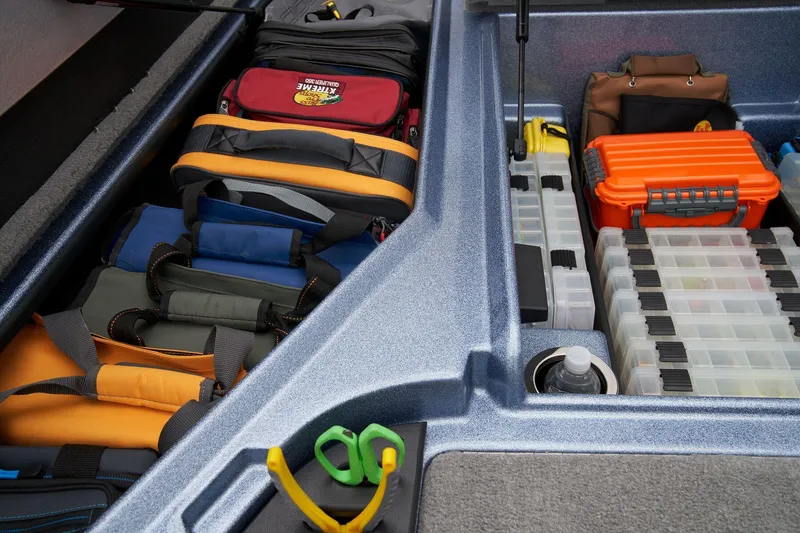 Slide: The Image of 2024 Nitro Z18 Pro storage compartments with organized fishing gear and tackle boxes. - 25