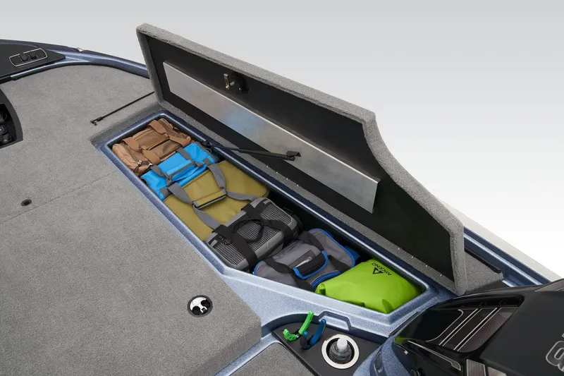 Slide: The Image of 2024 Nitro Z18 Pro boat storage compartment with gear and equipment. - 27