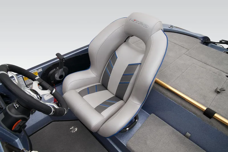 Slide: The Image of 2024 Nitro Z18 Pro boat interior with steering wheel and cushioned seat. - 44