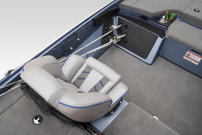 Slide: The Image of 2024 Nitro Z18 Pro boat interior with cushioned seating and fishing rod holders. - 47