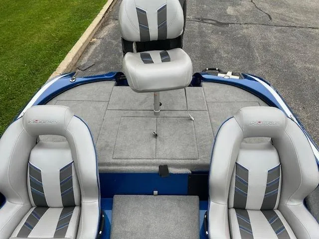 Slide: The Image of 2024 Nitro Z18 Pro boat interior with three gray and blue seats. - 5