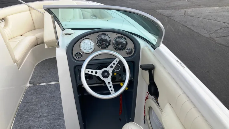 Slide: The Image of 2001 Chris-Craft Launch 25 boat dashboard and steering wheel. - 6