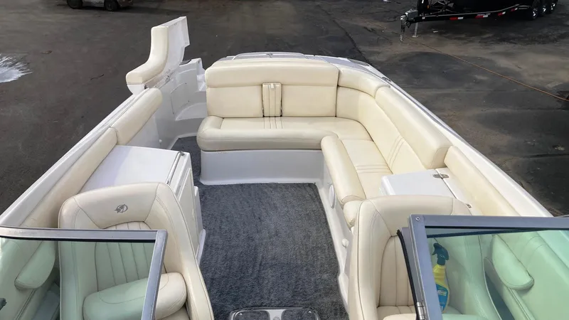 Slide: The Image of 2001 Chris-Craft Launch 25 boat with white leather seating and open deck. - 7