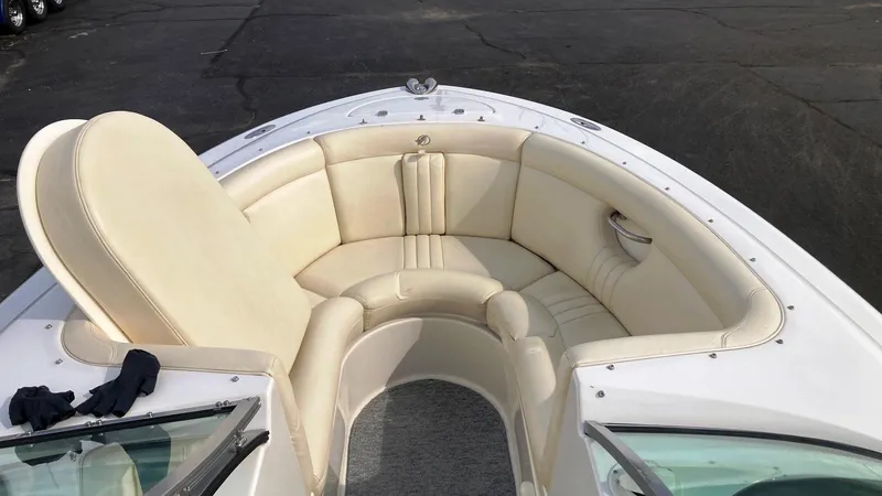 Slide: The Image of 2001 Chris-Craft Launch 25 boat with cream-colored seating in the bow area. - 8