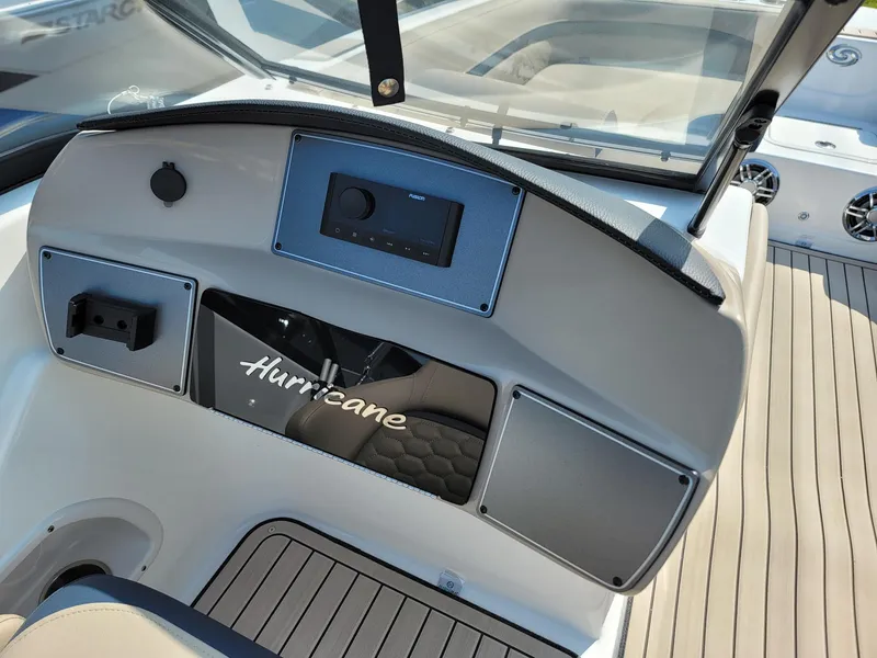 Slide: The Image of 2024 Hurricane SunDeck 217 OB boat dashboard with modern controls and sleek design. - 15