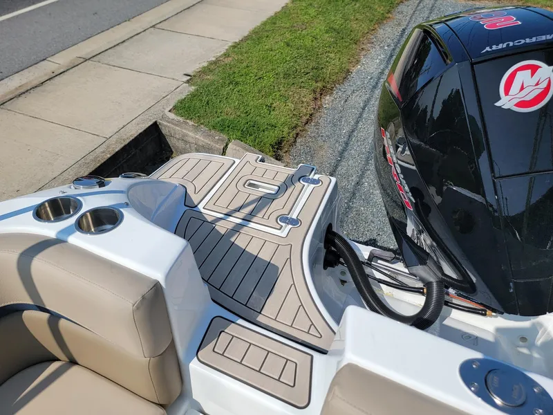 Slide: The Image of 2024 Hurricane SunDeck 217 OB boat with Mercury outboard engine, rear deck view. - 20