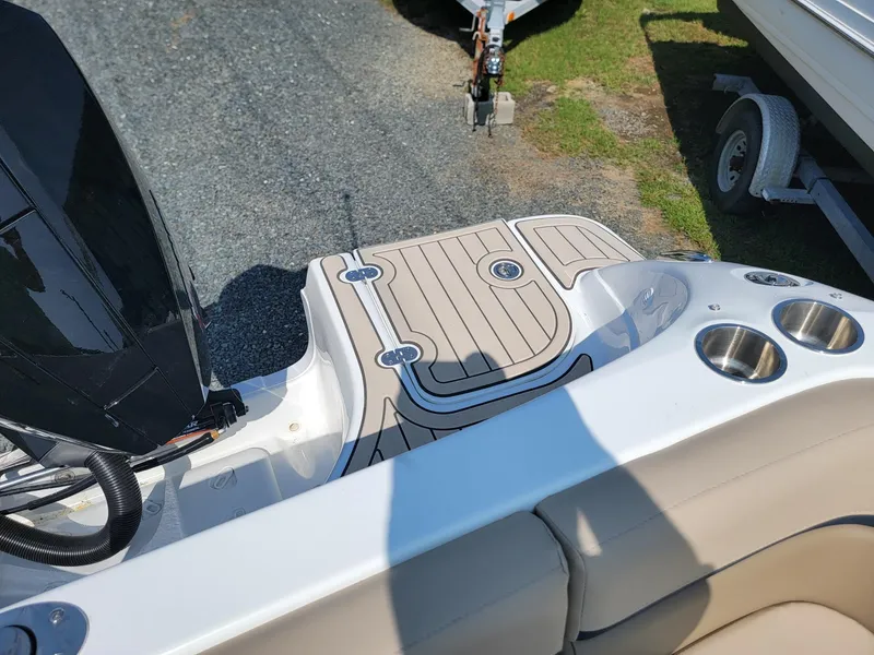 Slide: The Image of 2024 Hurricane SunDeck 217 OB boat deck with cup holders and seating. - 21