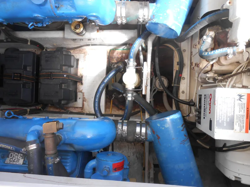 Slide: The Image of Engine compartment of 1989 Chris-Craft Amerosport 320 with blue components and wiring. - 10