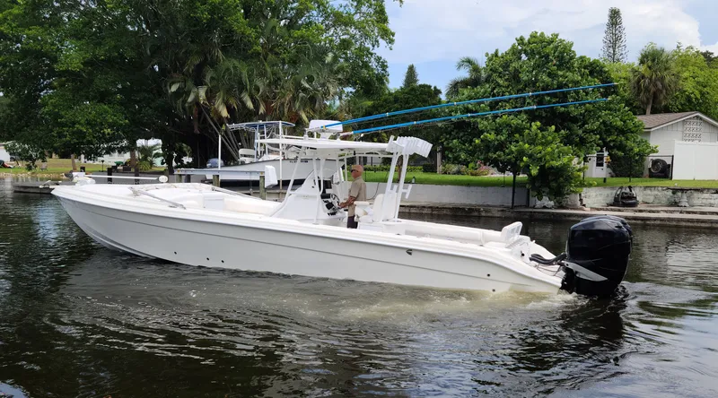 Slide: The Image of 2009 Glasstream 360 SCX boat cruising on a calm canal. - 1