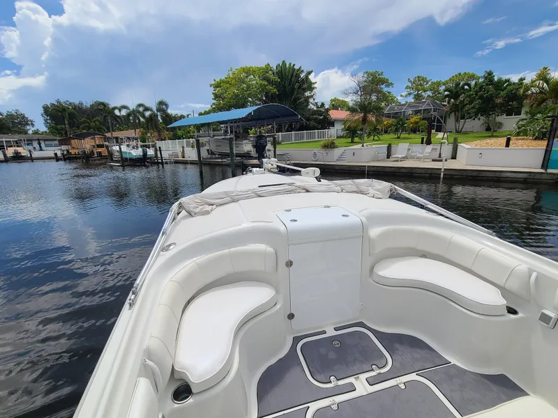 Slide: The Image of 2009 Glasstream 360 SCX boat docked in a serene waterfront setting. - 12