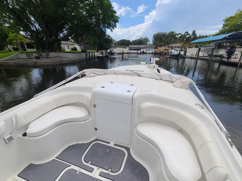 Slide: The Image of 2009 Glasstream 360 SCX boat interior, docked in a serene marina. - 13