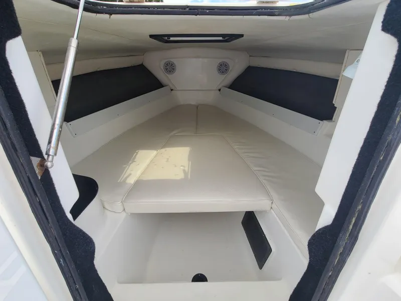 Slide: The Image of Interior cabin of a 2009 Glasstream 360 SCX boat with white cushioned seating. - 14