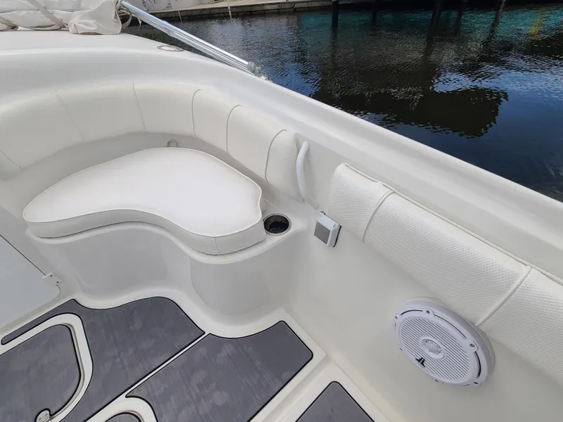Slide: The Image of 2009 Glasstream 360 SCX boat interior with white cushioned seating and cup holder. - 16