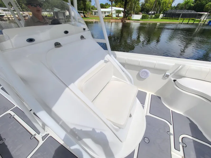 Slide: The Image of 2009 Glasstream 360 SCX boat interior with white seating and water view. - 18