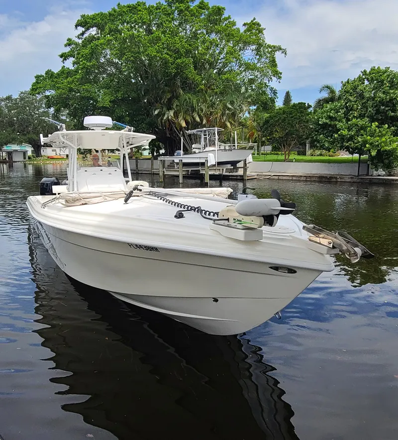 Slide: The Image of 2009 Glasstream 360 SCX boat docked on a calm river. - 2