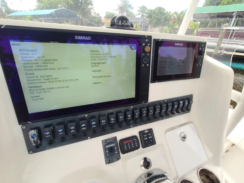 Slide: The Image of Control panel of a 2009 Glasstream 360 SCX boat with Simrad displays. - 23